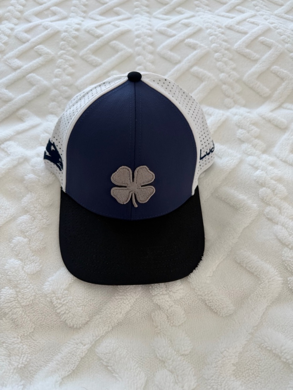 Live lucky Navy & Black Clover Patch Trucker Hat.